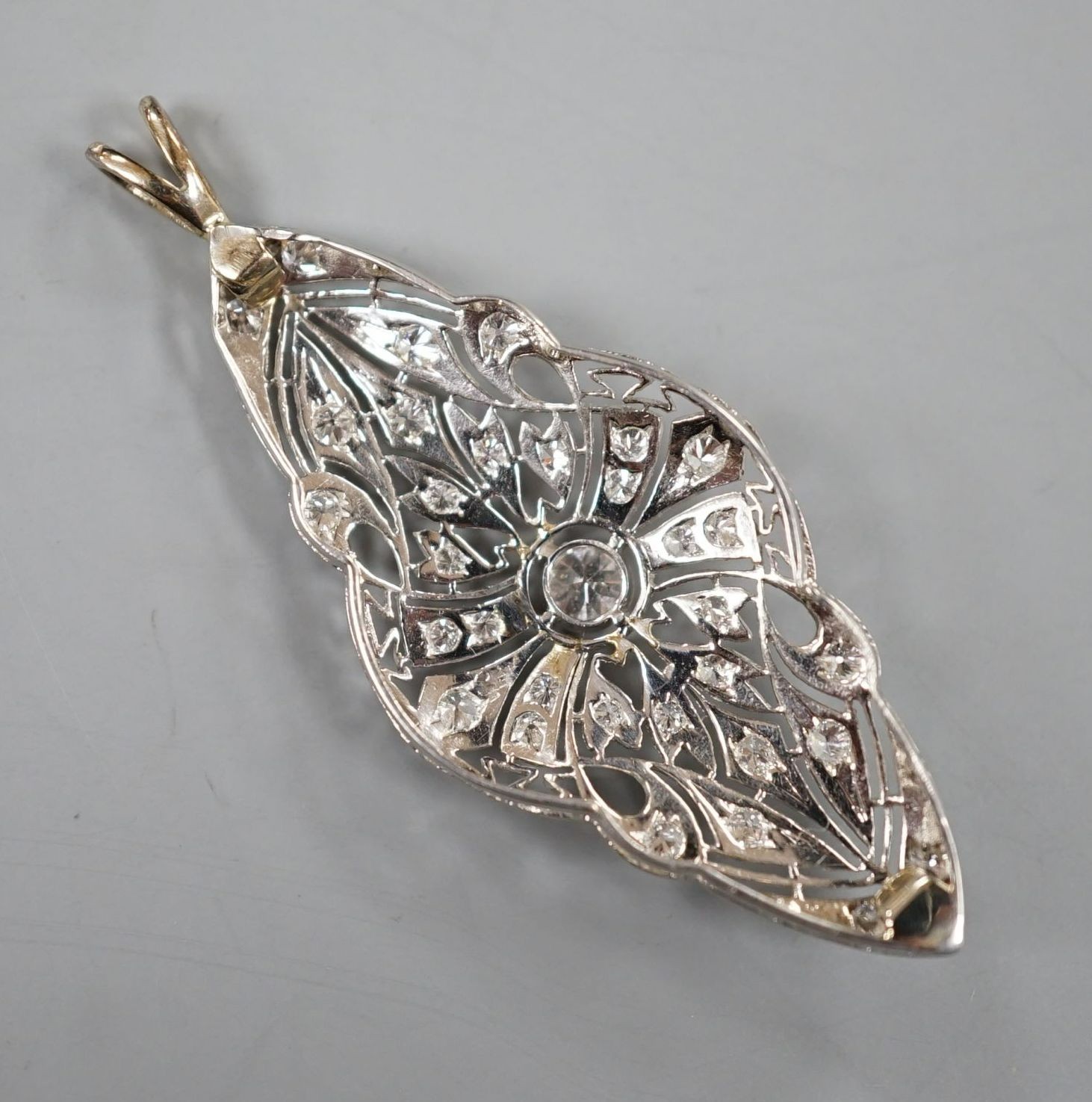 A Belle Epoque style white metal and diamond set quatrefoil shaped pendant, (adapted), 48mm, gross weight 4.4 grams.